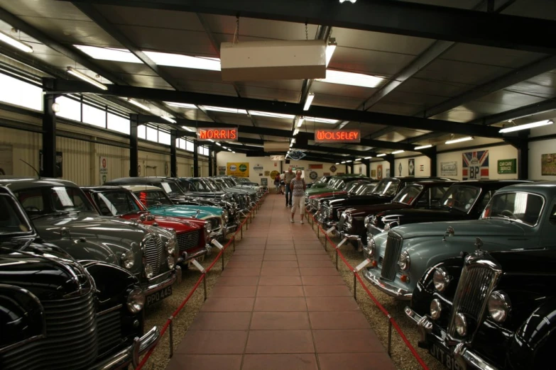 a couple of rows of parked cars inside of a garage