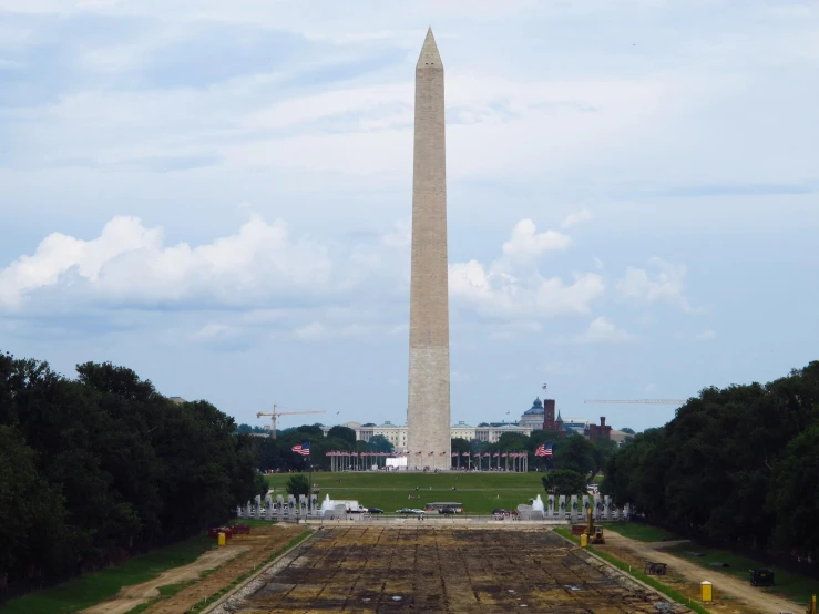 a view of a large monument in the middle of an open park