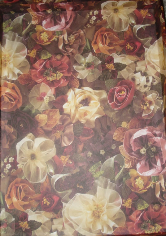 some multicolored flowers on a brown, red and white background