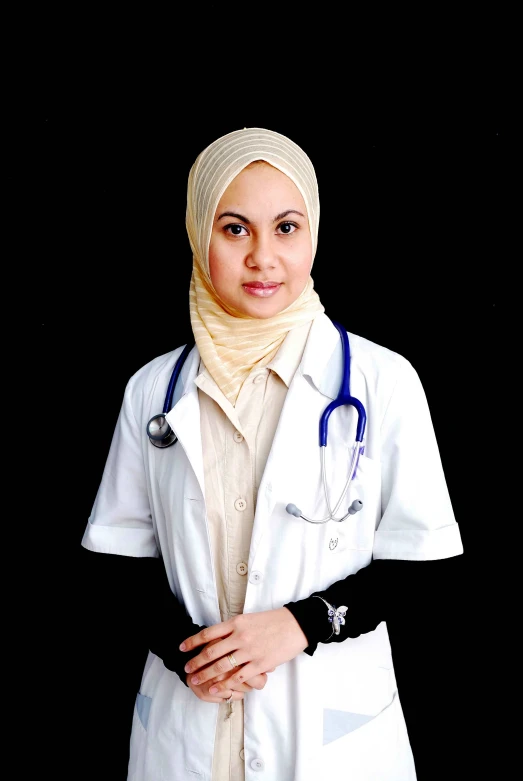a young woman with a headscarf on and a stethoscope around her neck