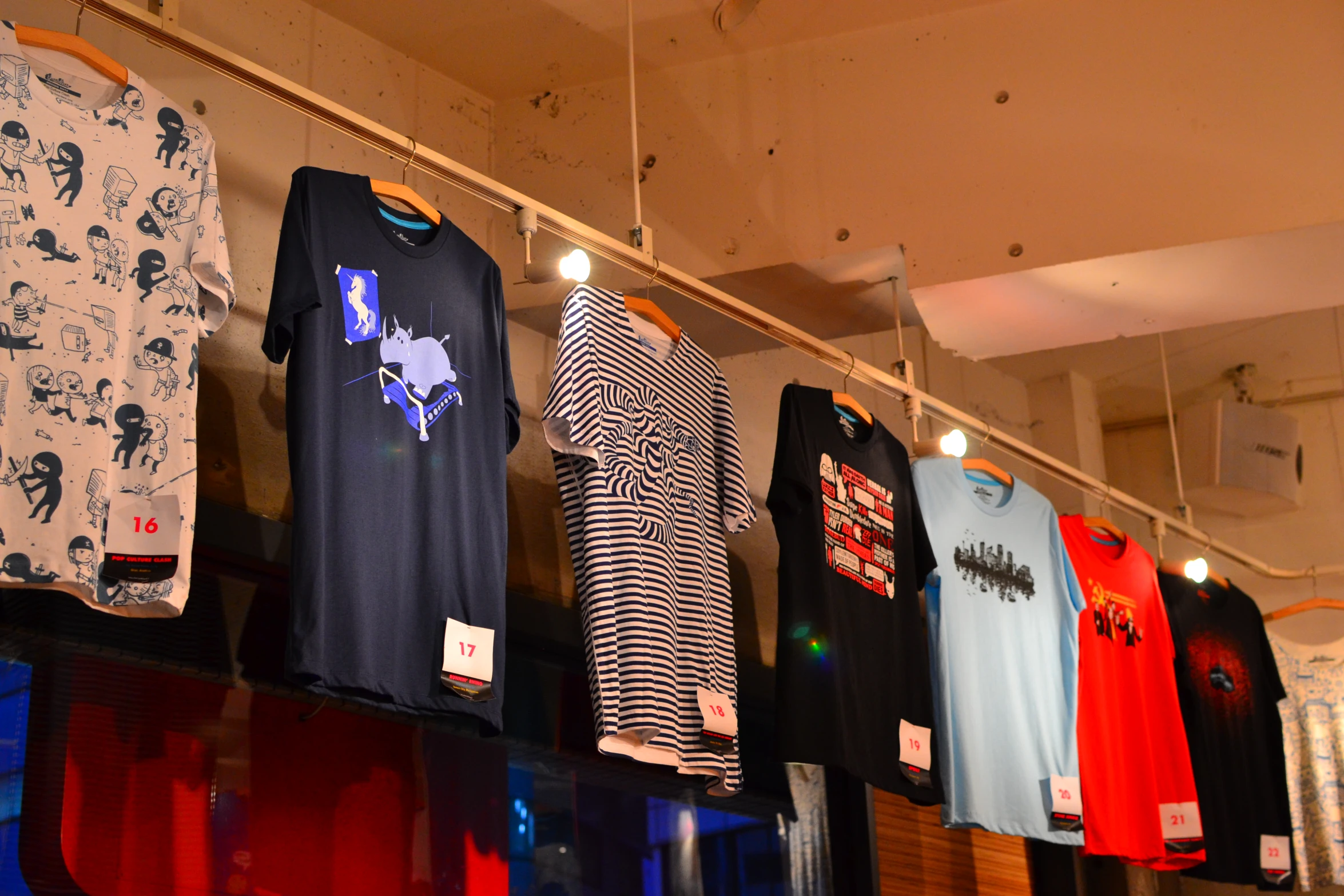 the shirts have been displayed on display in a store