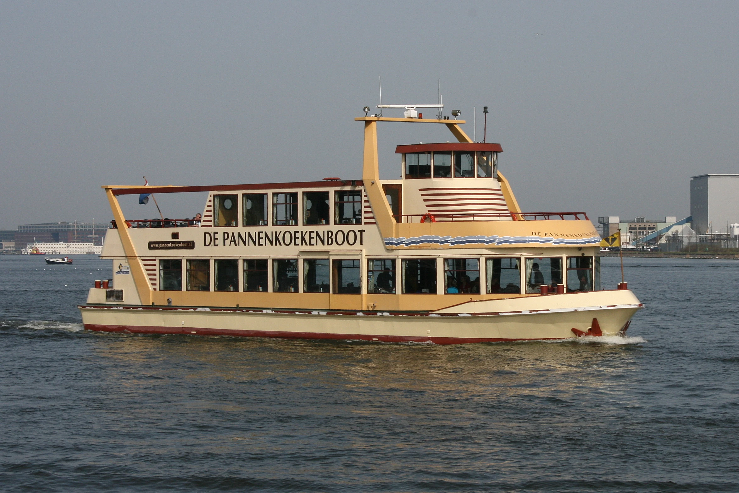 a big boat that is going out to sea on the water