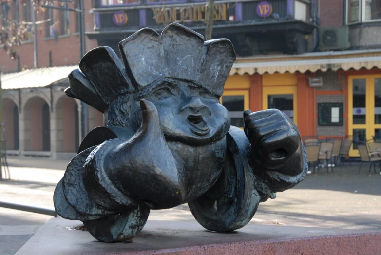 a statue of a smiling elephant with its mouth open