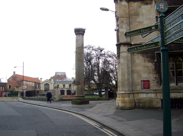 a town square with some old structures in the background