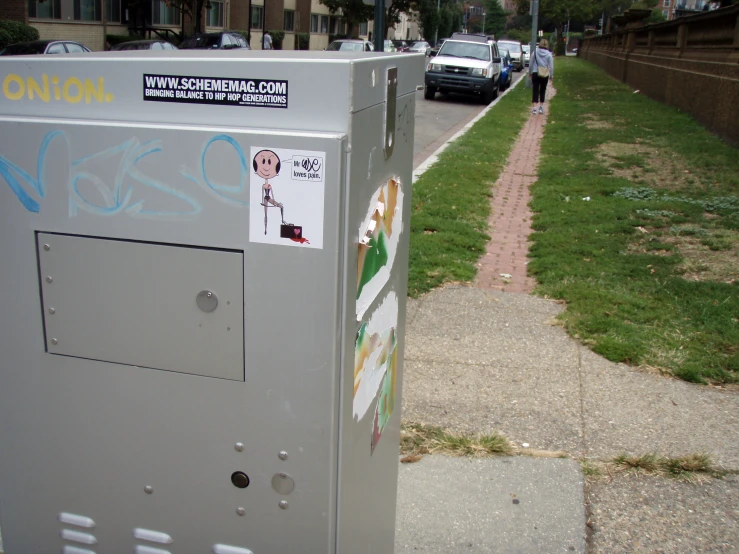 a bunch of stickers on a phone booth