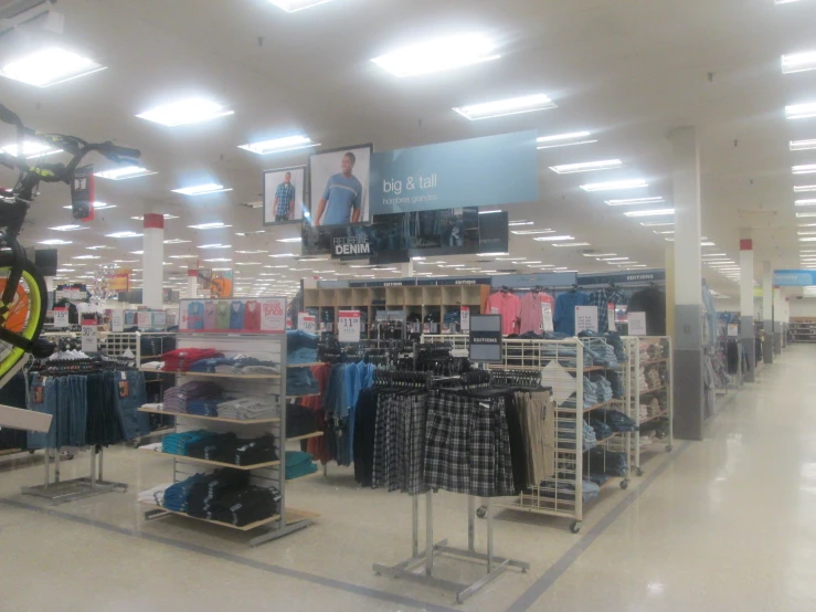 an inside view of a clothes store in a mall