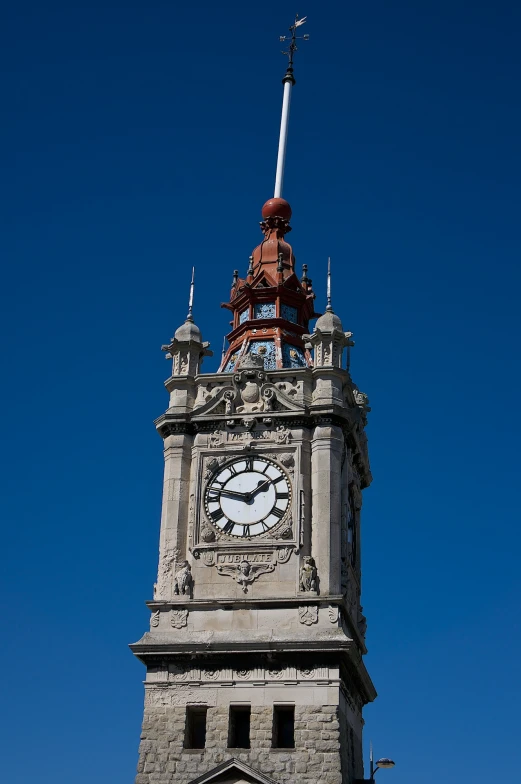 the clock is sitting on the stone tower