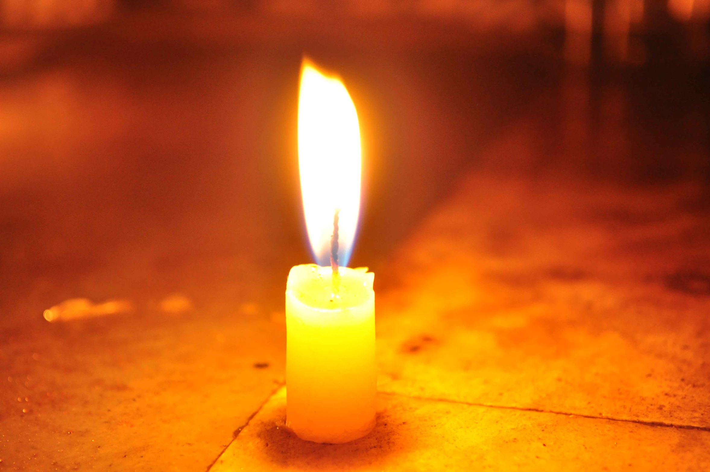 an up - close view of a candle that is lit