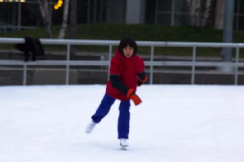 a  skating on the snow outside in the winter