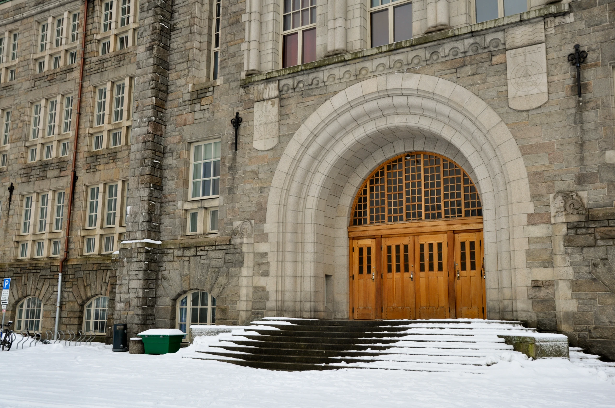 snow blankets steps leading into a stone building