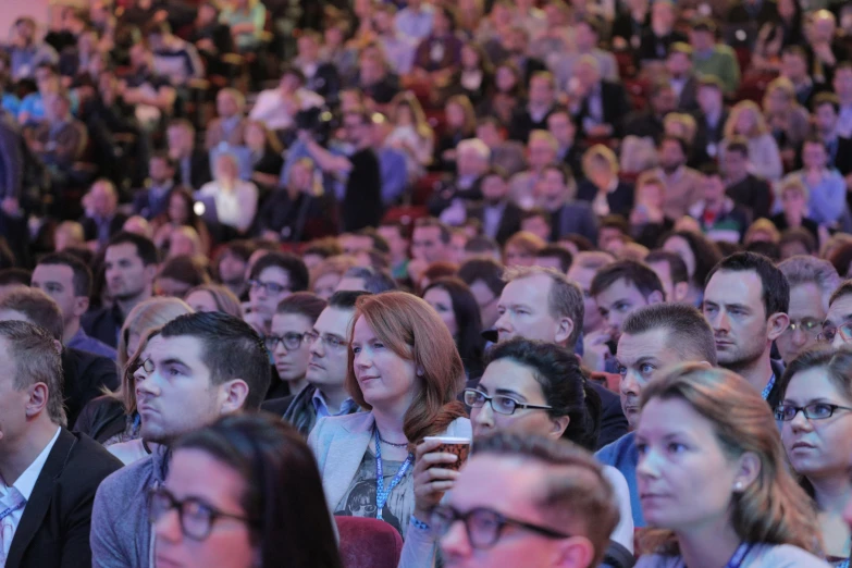 people are sitting down and watching soing or speaking