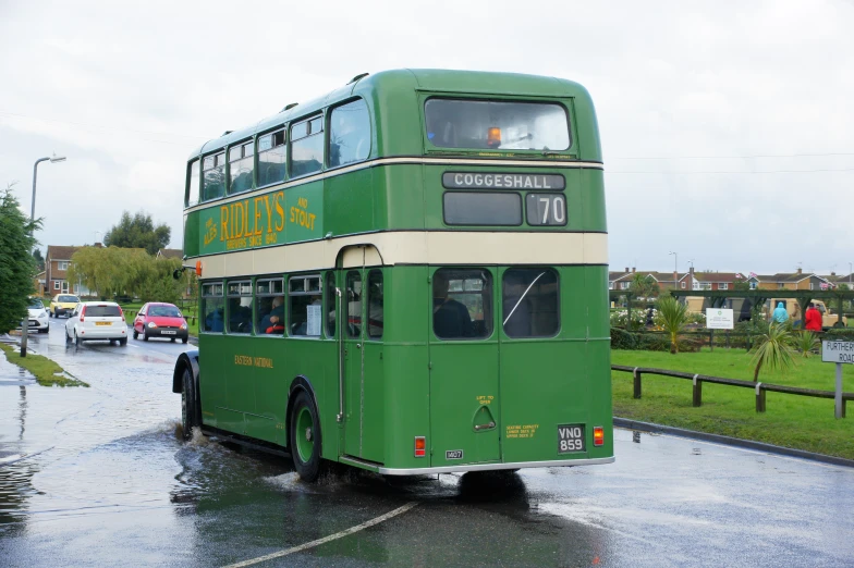 the two level bus is on the wet street