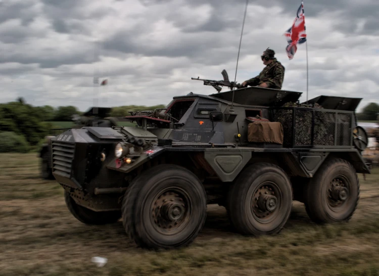 military men in their jeep during a parade