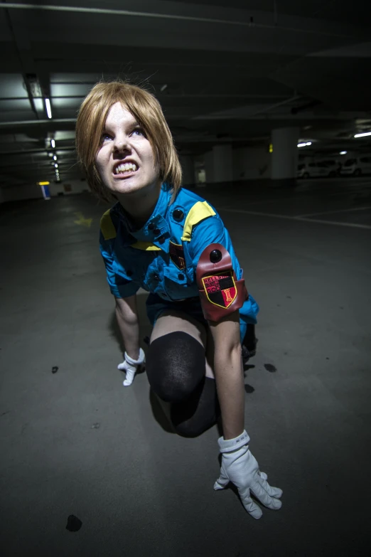 a woman posing in an empty parking garage