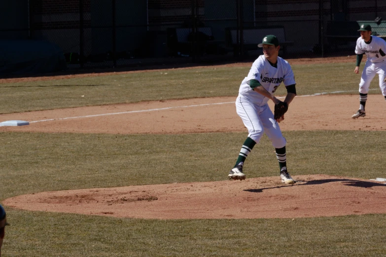 a baseball player getting ready to pitch the ball