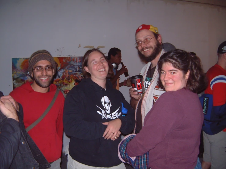 a group of people standing together and smiling at the camera