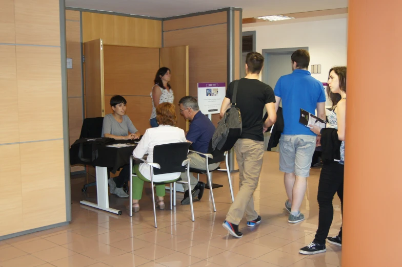 a group of people are gathered around a table