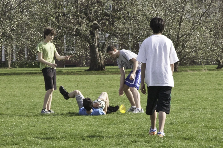 the three guys are having fun playing frisbee