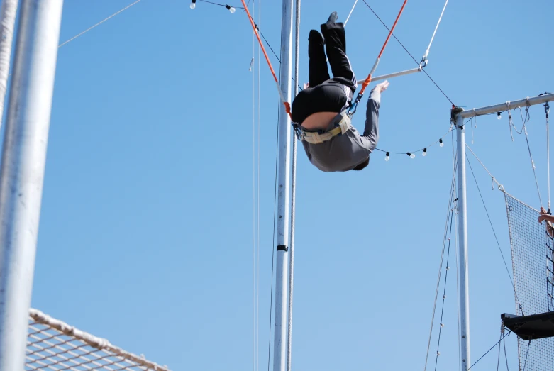 man on aerial rope during sport activity in open air