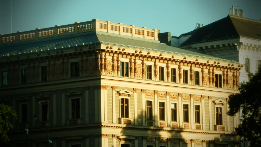 the silhouette of a large building against the sky