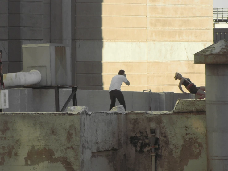 two people on skateboards going over a gap