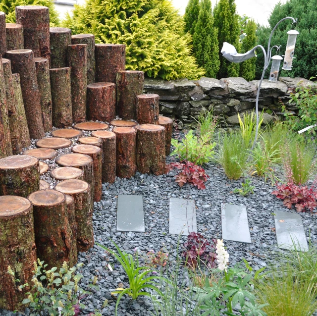 a number of logs arranged on top of a stone floor