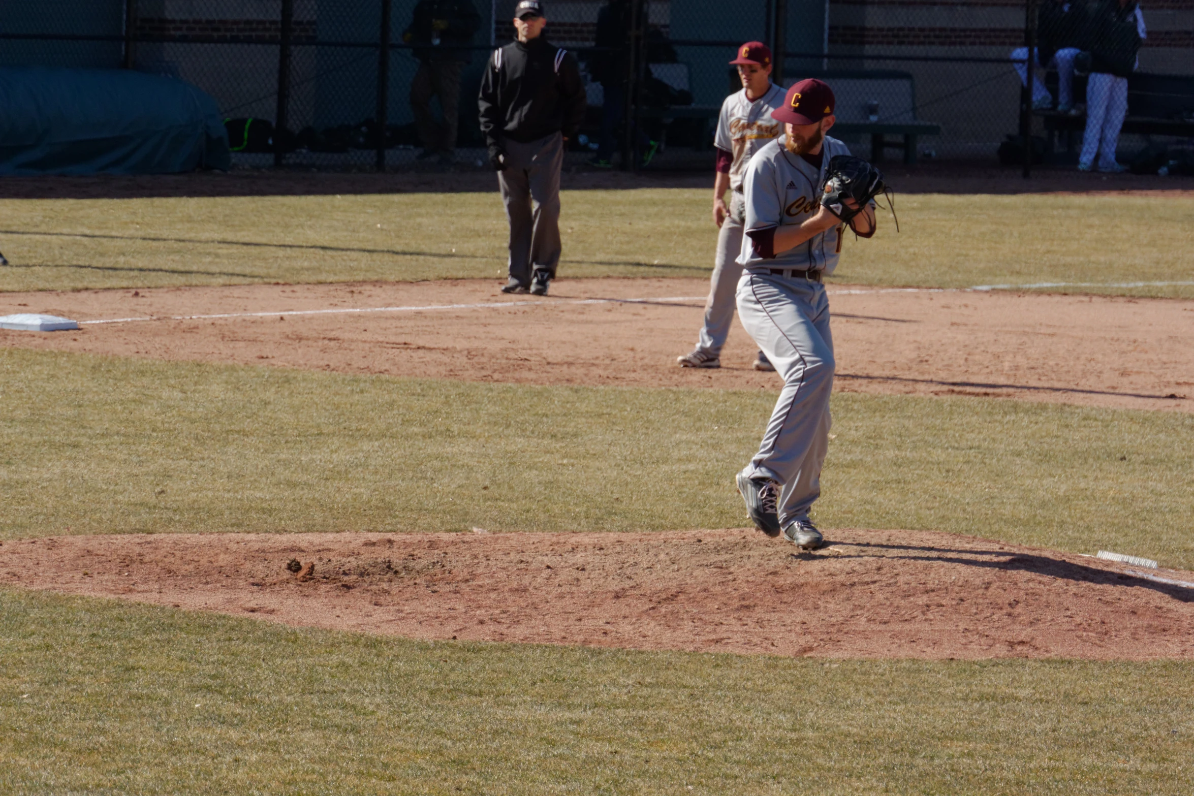 a pitcher is in the middle of a baseball game