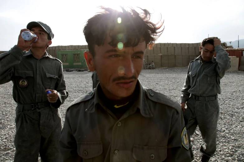 two men in uniform are standing near one another