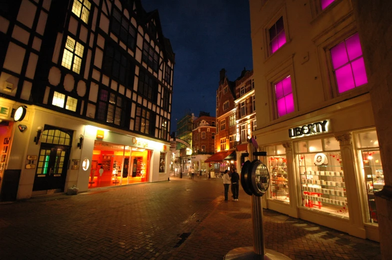 the street has several stores in it and at night