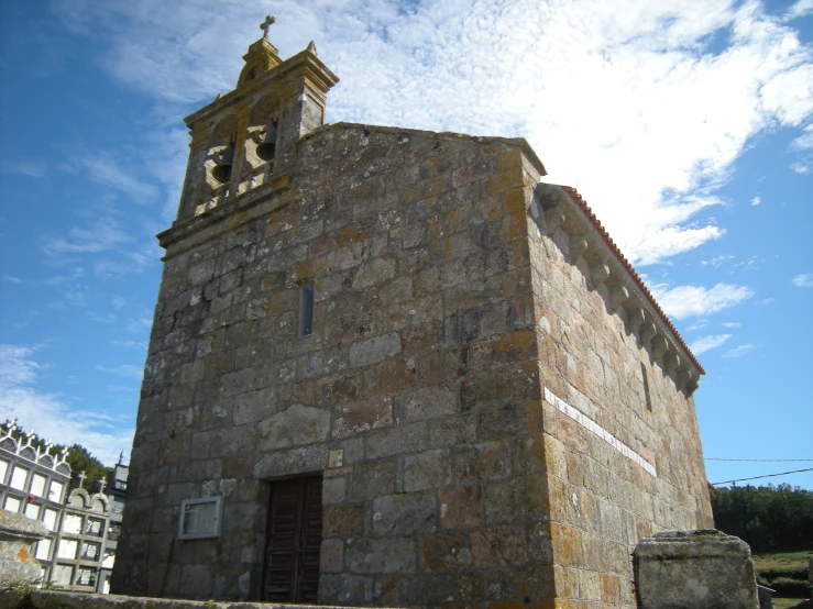 an old building with a tall tower in the background