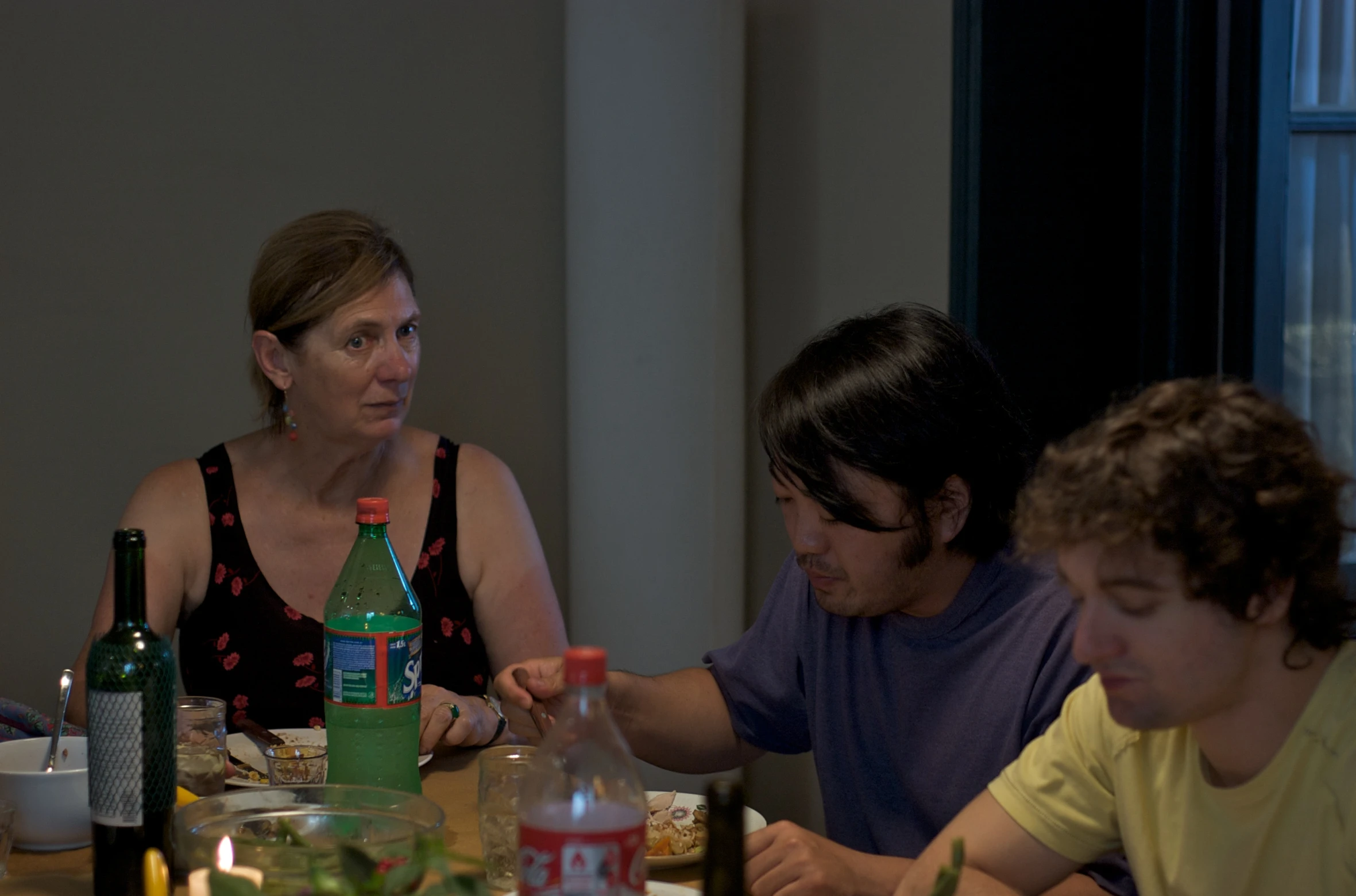 a man and woman sitting down to eat dinner