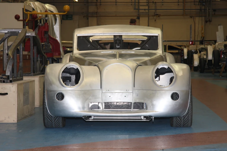 the vehicle is silver in color with some metal highlights