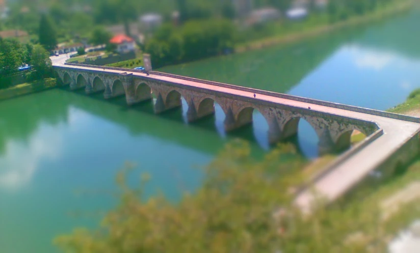 an aerial view of a bridge and a river