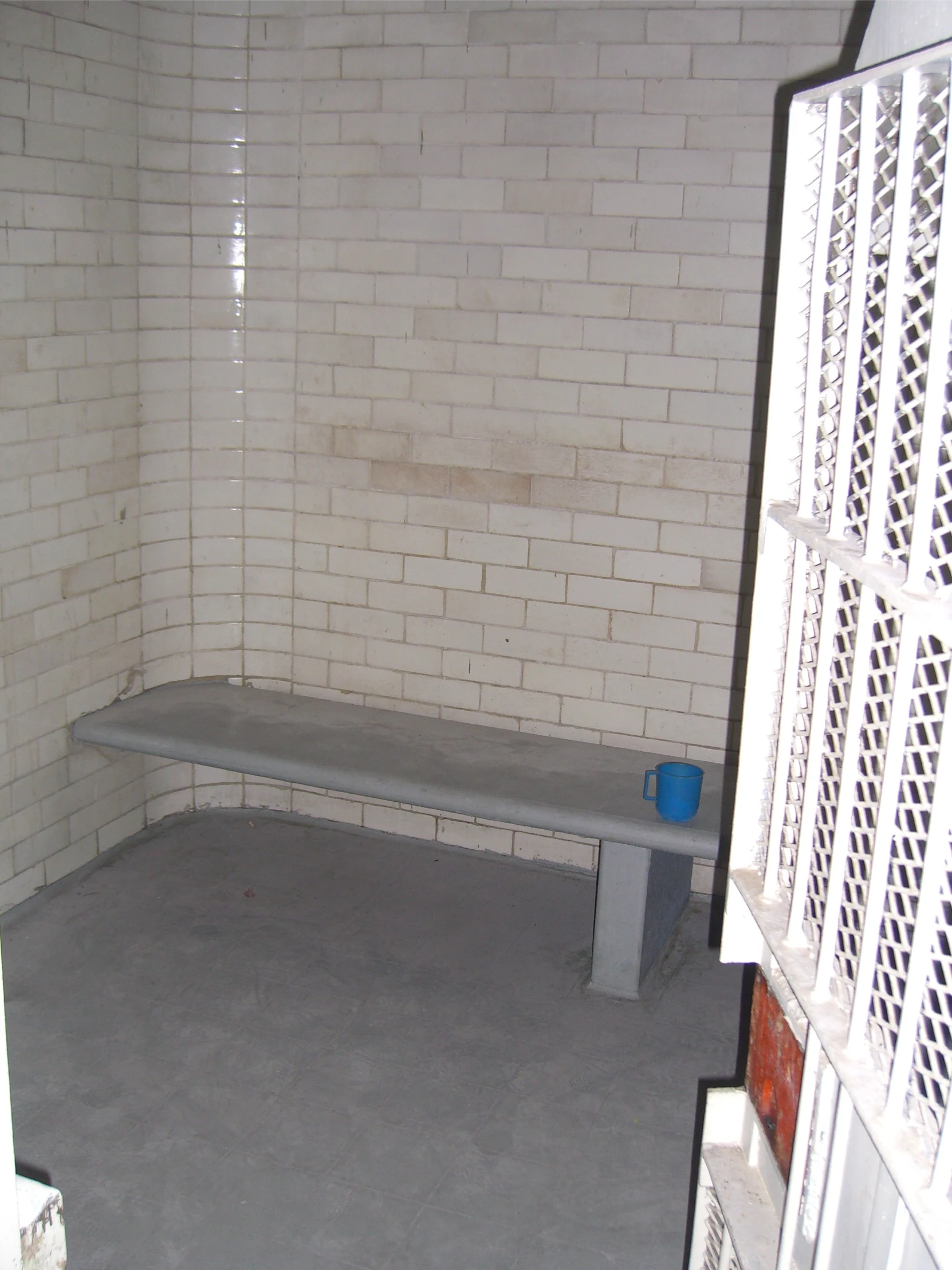 a bench in an empty  cell