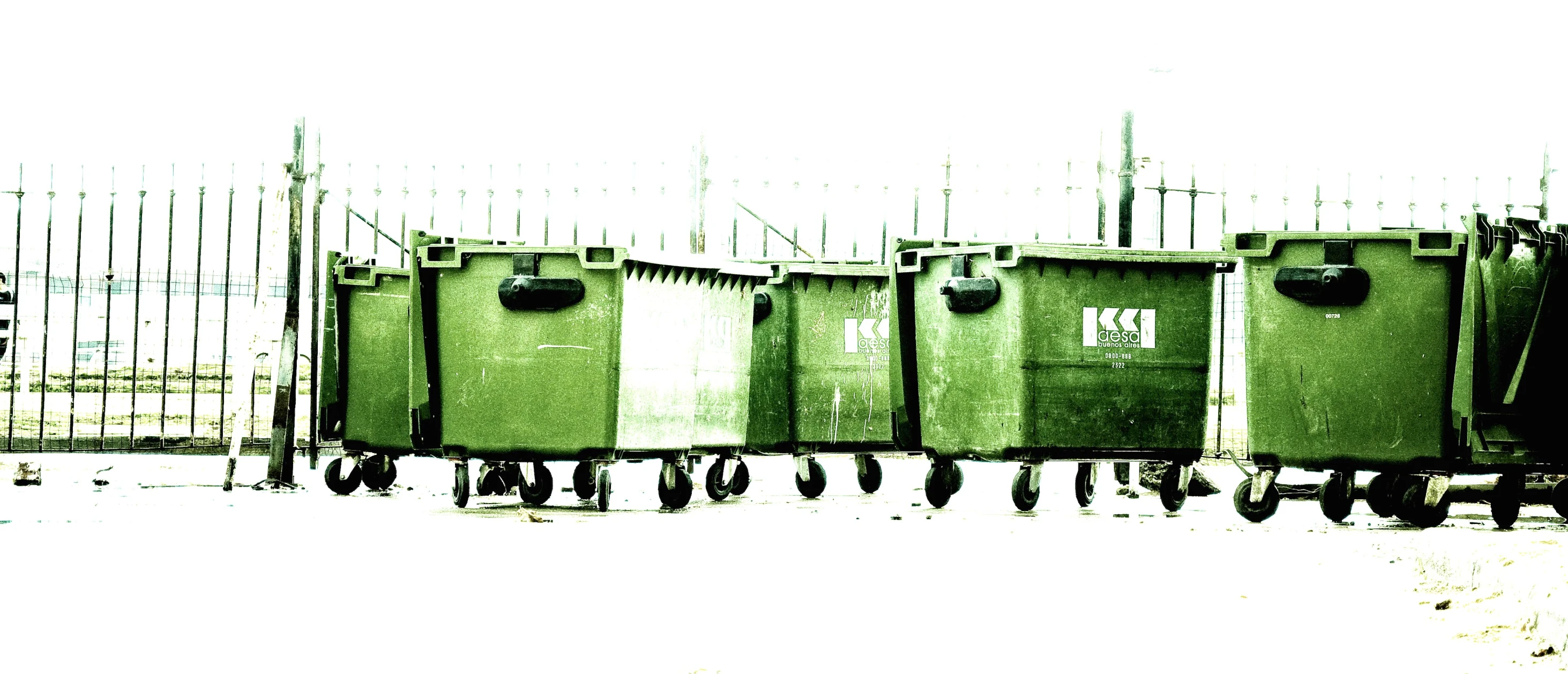 two trolleys stacked up against each other on a snowy surface