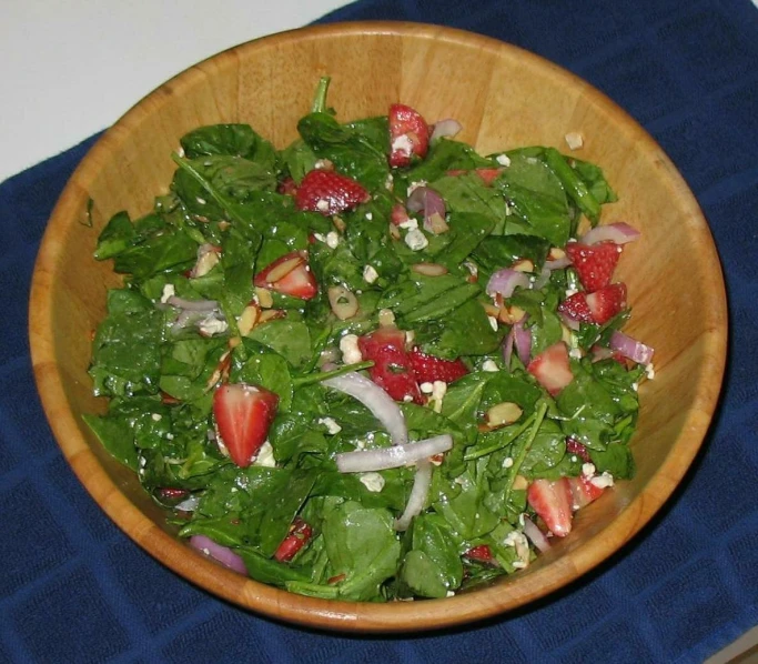 this is a salad with spinach and strawberries