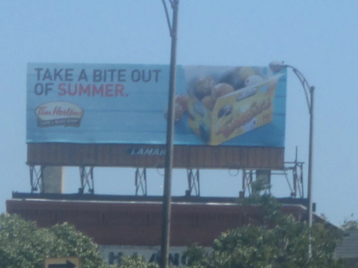 there is a large billboard advertising a fruit