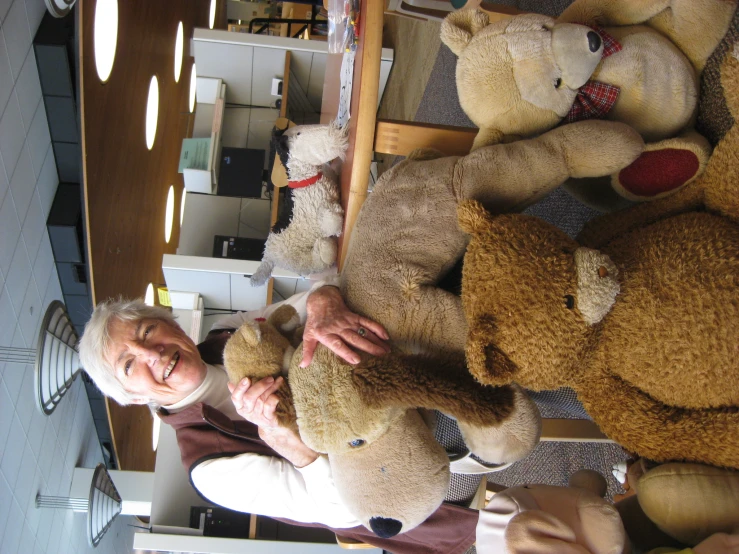 an older man with a bunch of teddy bears