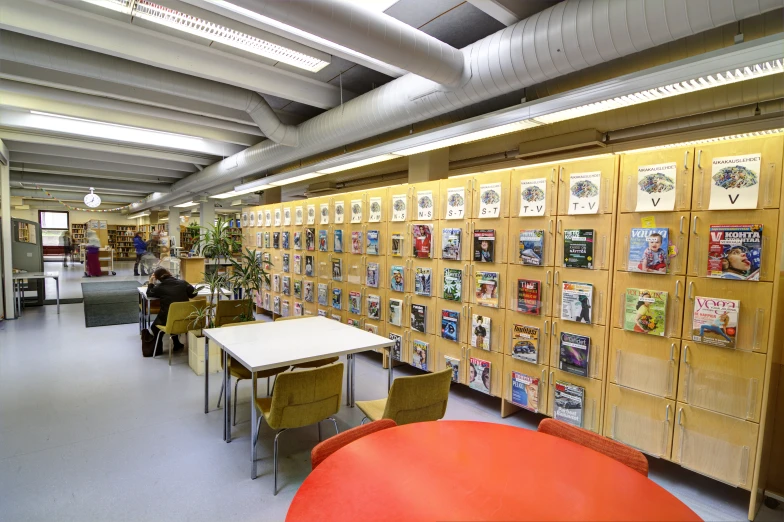 an empty liry has many books on a display