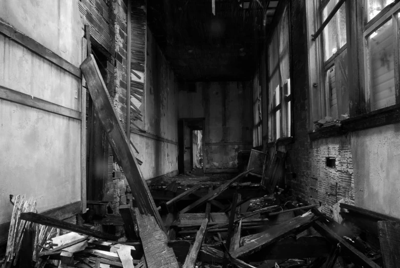 an abandoned building with broken doors and windows