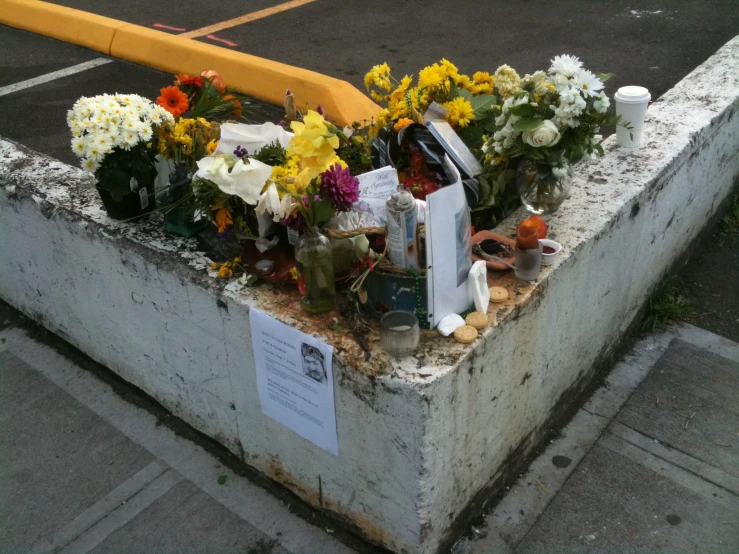 a concrete box with a bunch of flowers in it