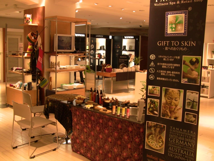 a woman sits at a counter in a beauty shop