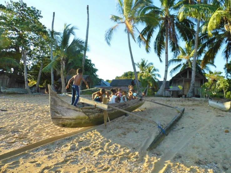 people are sitting on the bottom of a boat