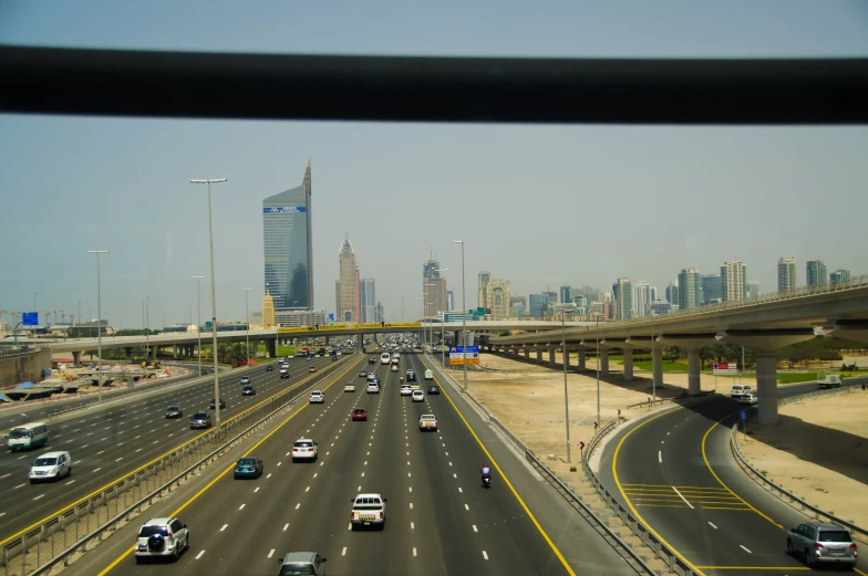 a busy freeway in the city and an empty highway near a bridge