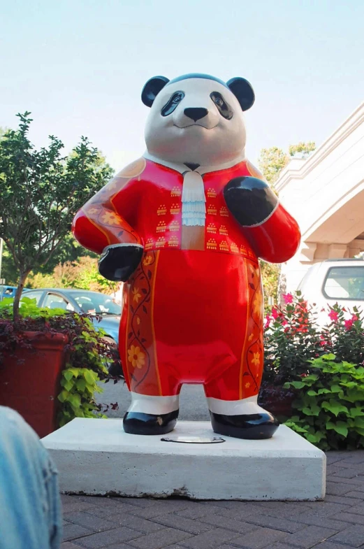 a large statue of a large bear in red