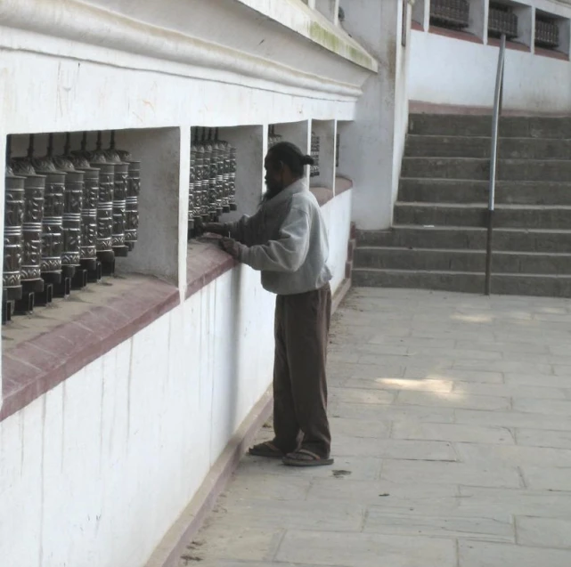 an older man holding a case full of things