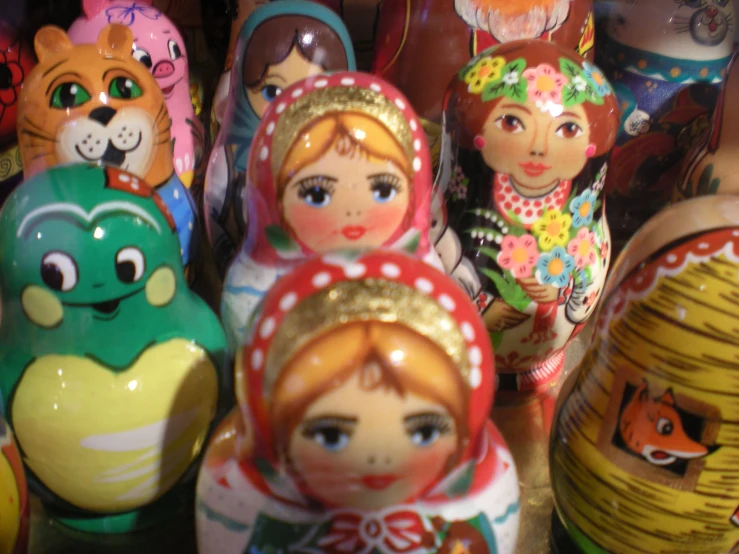 dolls are lined up in a rack