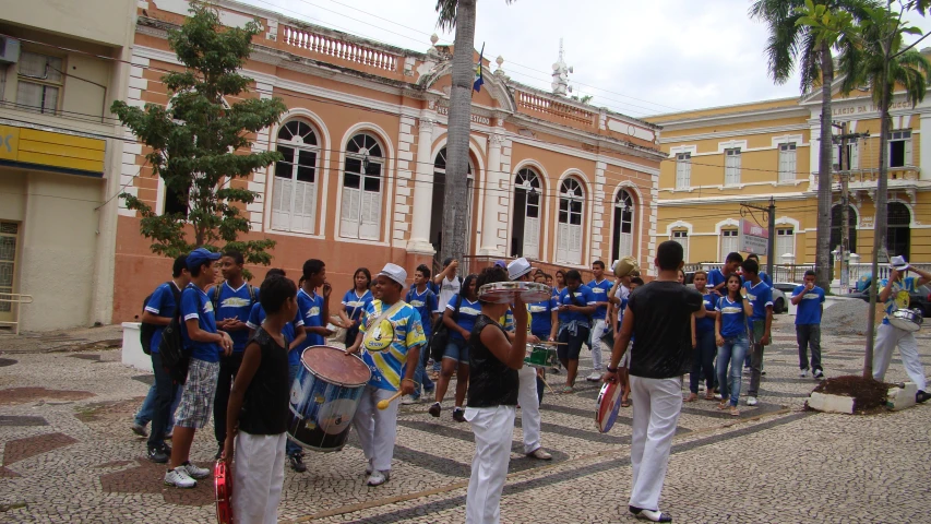 a group of people with musical instruments on a street