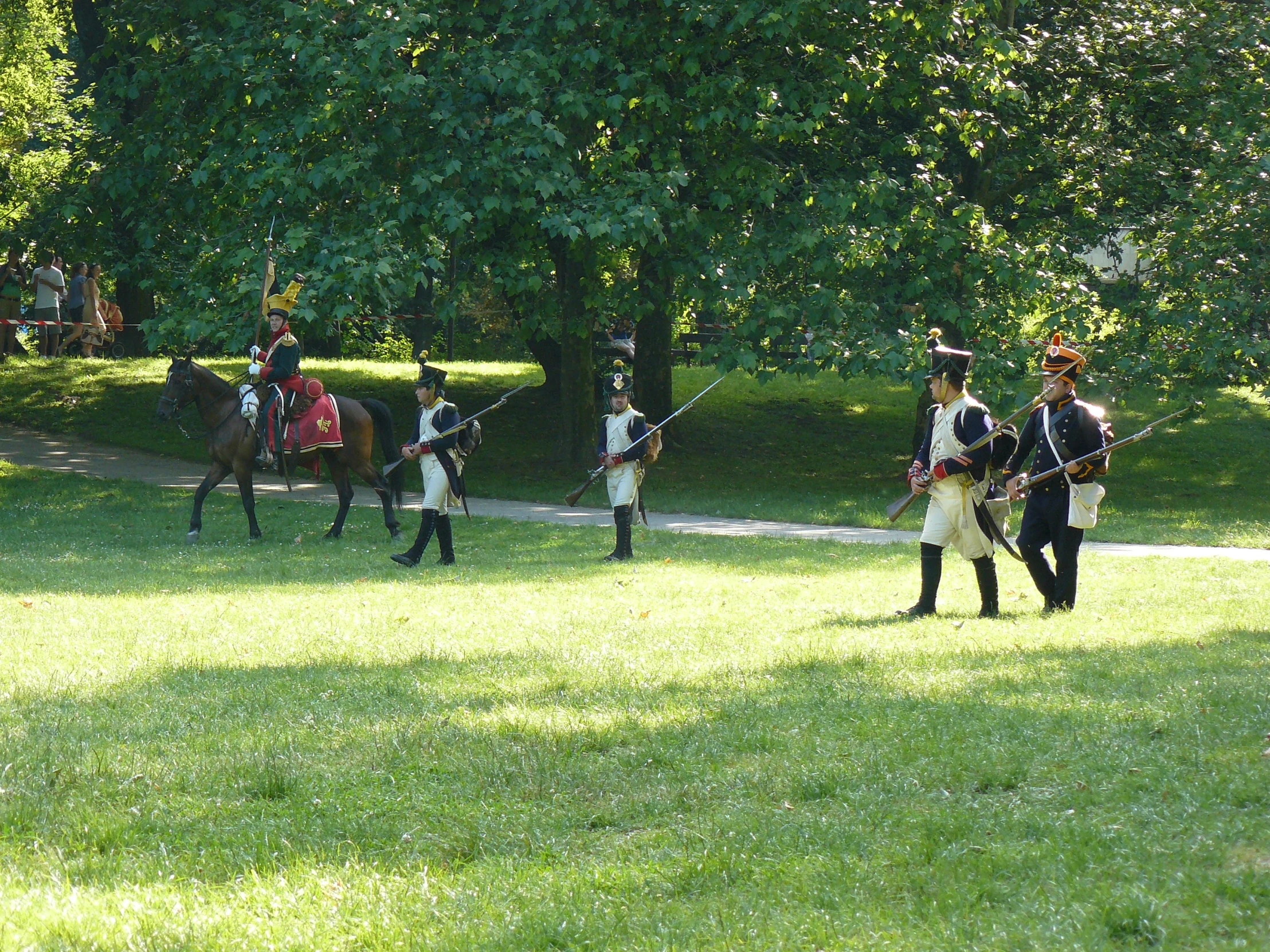 men in uniforms playing on horseback and golf