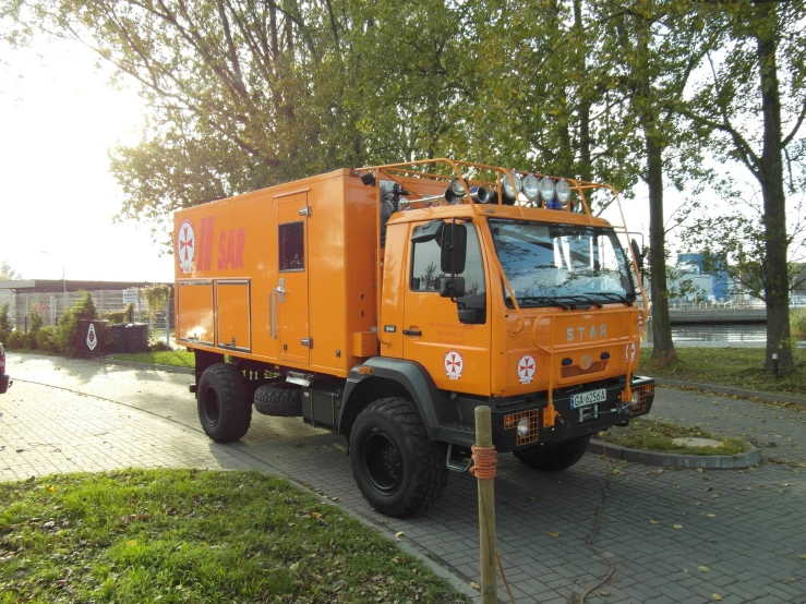 the truck is parked next to a parking lot